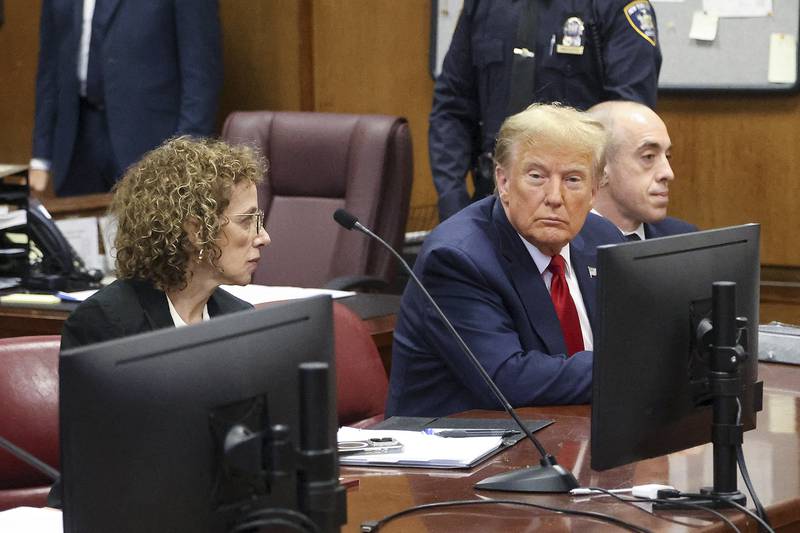 Donald Trump awaits the start of a hearing in New York City Criminal Court, Thursday, February 15, 2024. A New York judge says former President Donald Trump's hush-money trial will go ahead as scheduled with jury selection starting on March 25. (Jefferson Siegel for The New York Times via AP, Pool)