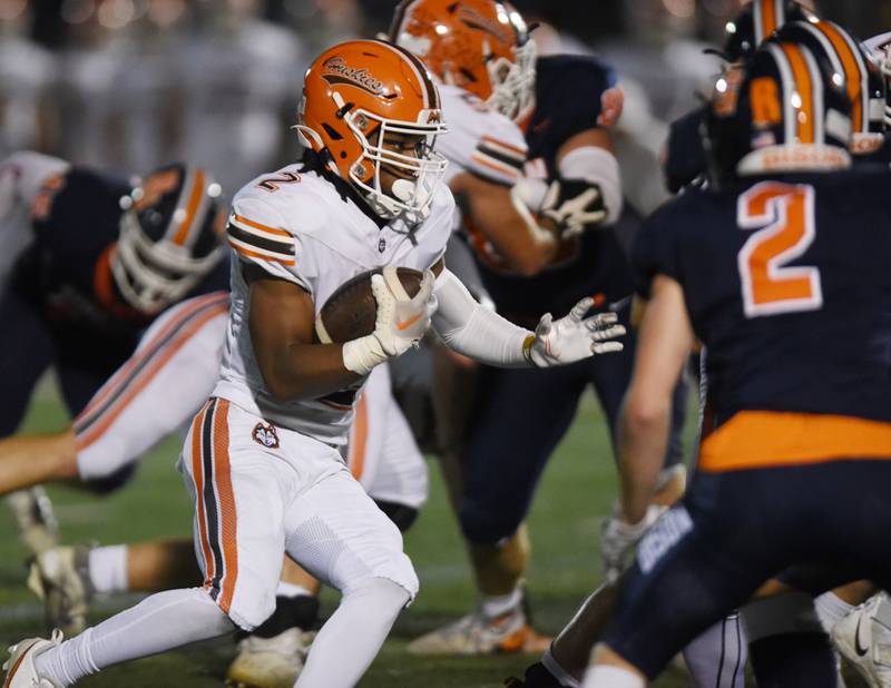 Joe Lewnard/jlewnard@dailyherald.com
Hersey’s Nasir Mckenzie carries the ball during Friday’s game at Buffalo Grove.
