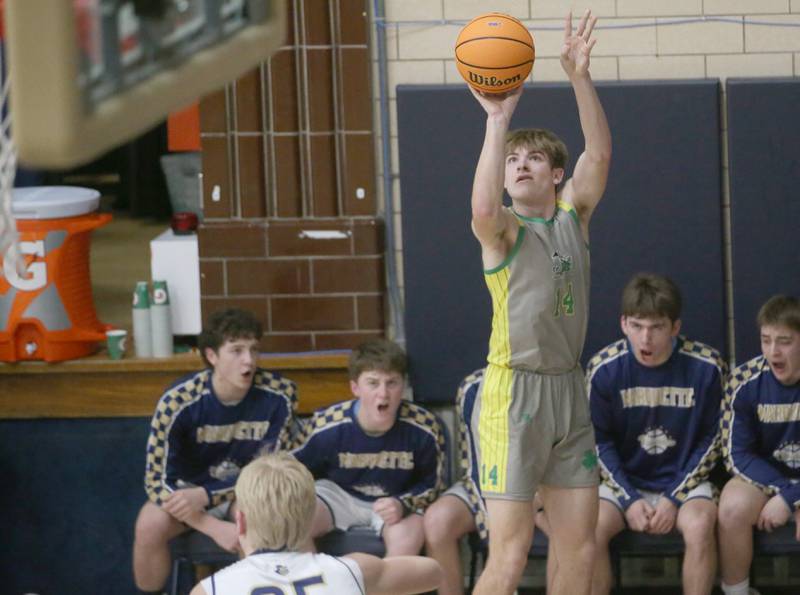 Seneca's Cameron Shriey lets go of a jump shot over Marquette's Luke McCullough on Friday, Feb. 21, 2025 in Bader Gym at Marquette Academy.