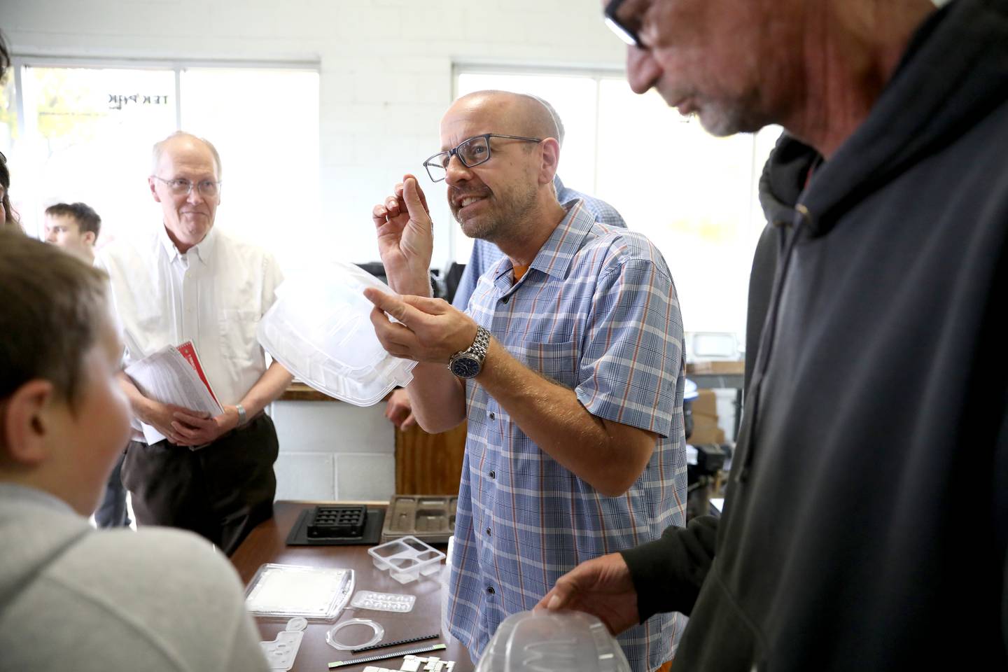 Mike Polansky (center), tooling designer at Tek Pak, Inc. in Batavia, talks with students from St. Charles School District 303’s Compass Academy on Wednesday, Oct. 23, 2024 as part of Manufacturing Month.