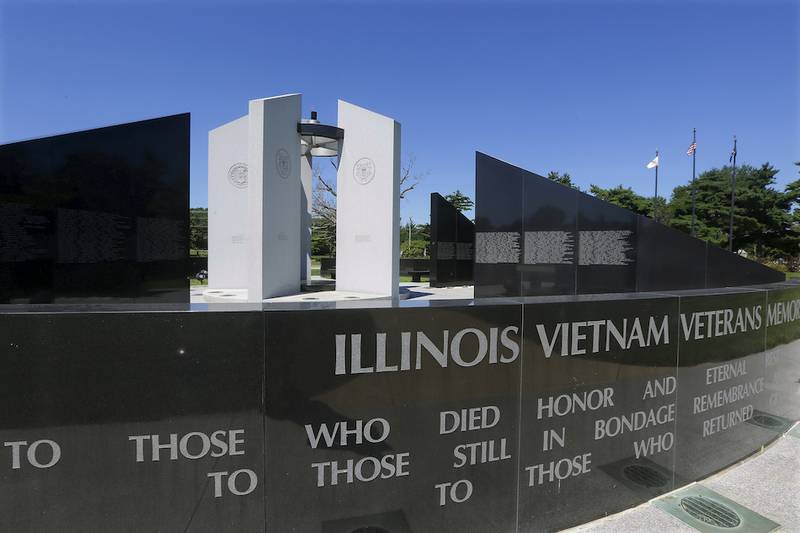 A torch burns atop of the Vietnam Veterans Memorial, Thursday, July 30, 2015, in Springfield, Ill.