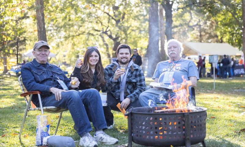 (From left) Bob Marecek, Lauren McCutcheon, James Dileonardi and Kevin Cody set a welcoming fire pit at Berwyn’s Best Beer Festival on Saturday, October 8, 2022 at Proksa Park.