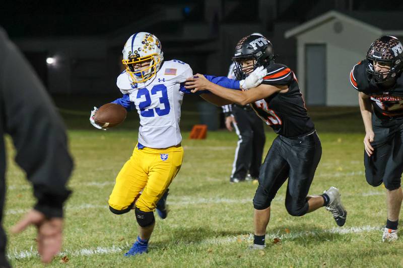 Alec Gustafson of Galva runs with ball as Jaxon Torrez of Flanagan Cornell Woodland attempts to tackle on Friday, October 25, 2024 at Flanagan High School in Flanagan.