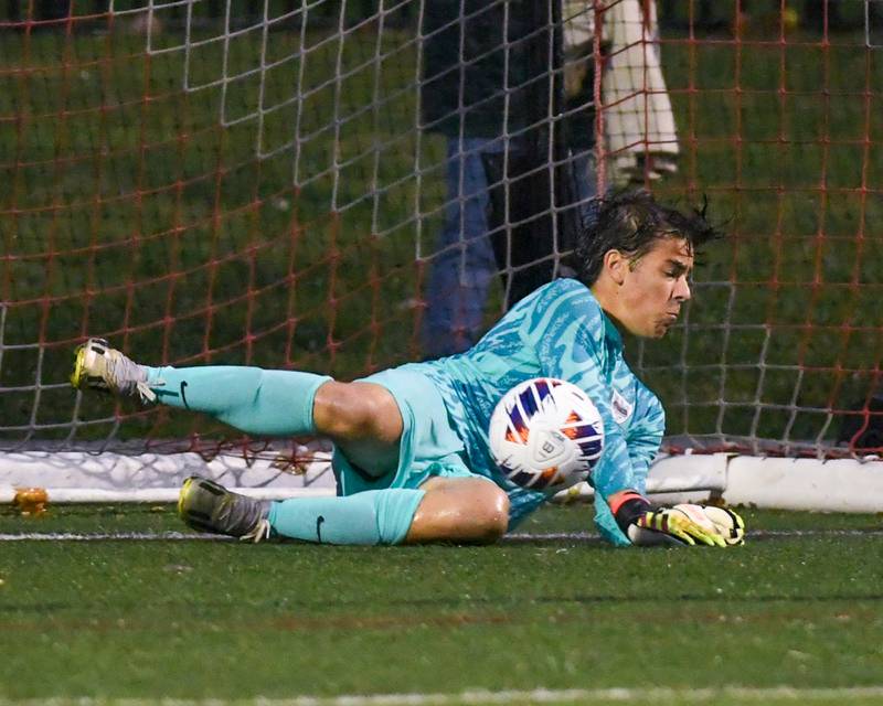 Benet Academy's Patrick Stasch (1) blocks a penalty kick shot during the class 2A super sectional soccer match on Tuesday Nov. 5, 2024, held at Wheaton Academy in West Chicago.