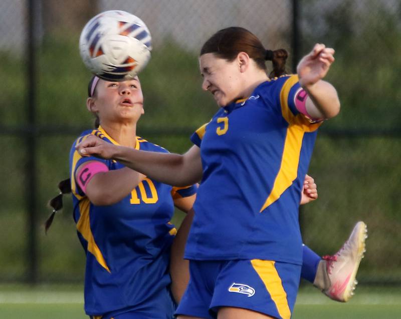 Johnsburg's London Baidinger and Elaina Moss team up to play the ball during an IHSA Class 1A Cristo Rey St. Martin Sectional semifinal girls soccer match against Cristo Rey St. Martin on Tuesday, May 26, 2026 at Cristo Rey St. Martin College Prep, in Waukegan.