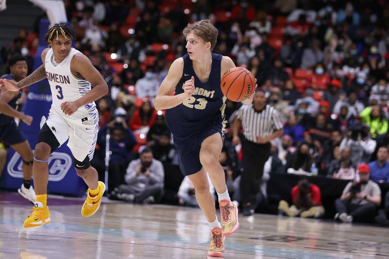 Lemont’s Nojus Indrusaitis looks for a play against Simeon in the Class 3A super-sectional at UIC. Monday, Mar. 7, 2022, in Chicago.