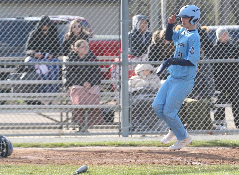 Marquette's Easton Debarnardi scores a run against Woodland/Flanagan-Cornell on Wednesday, March 27, 2024 at Masinelli Field in Ottawa.