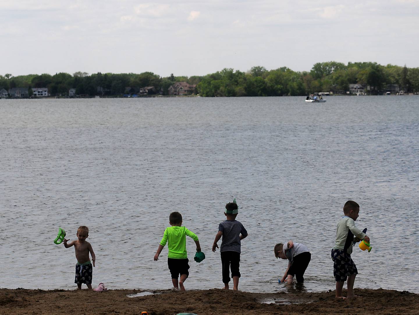 Children from a birthday party play on the beach Monday, May 23, 2022, at Crystal Lake's Main Beach, 300 Lakeshore Drive, in Crystal Lake.