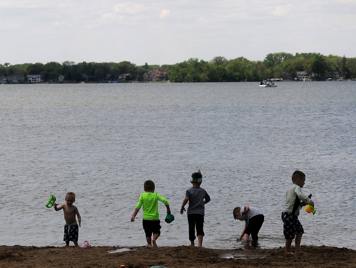 Children from a birthday party play on the beach Monday, May 23, 2022, at Crystal Lake's Main Beach, 300 Lakeshore Drive, in Crystal Lake.