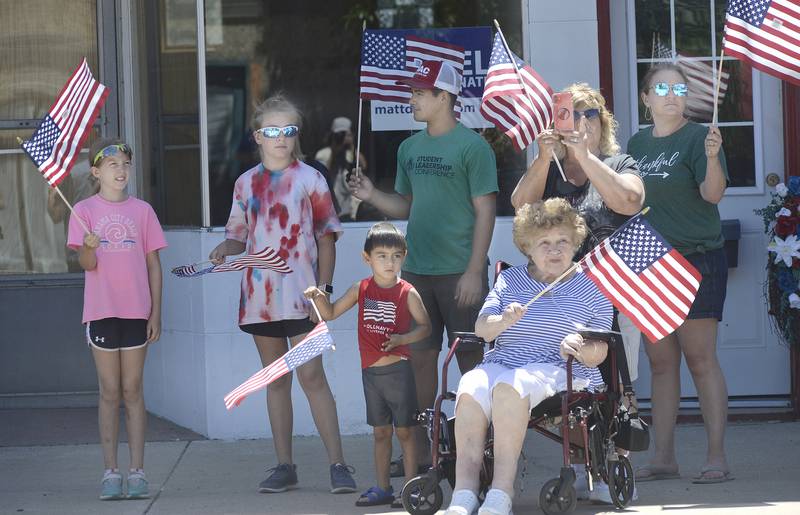 Along Main Street in Marseilles, residents cheer on the many motorcycle riders arriving into town Saturday, June 18, 2022, for the Illinois Motorcycle Freedom Run.