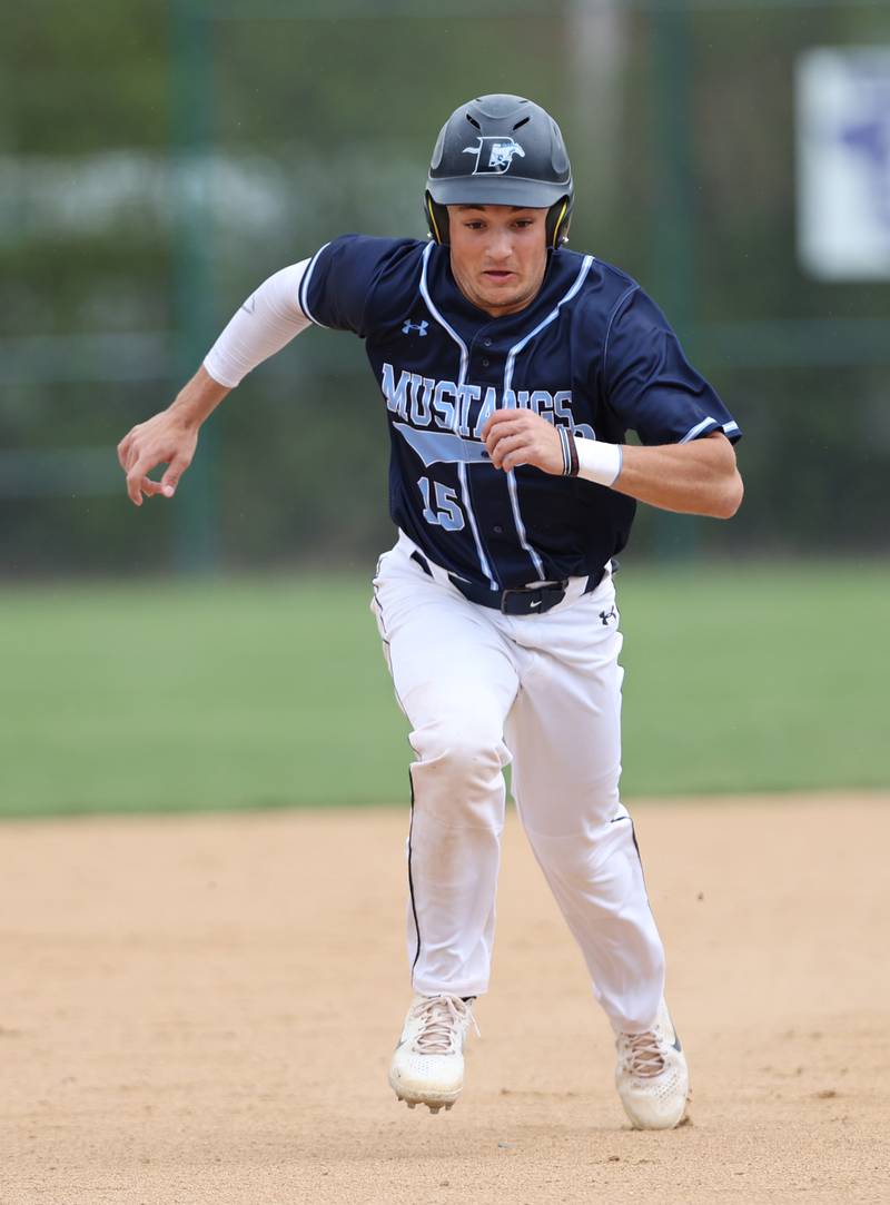Downers Grove South's Anthony Titone (15) breaks for third during the varsity baseball game between Downers Grove South and Downers Grove North in Downers Grove on Saturday, April 29, 2023.