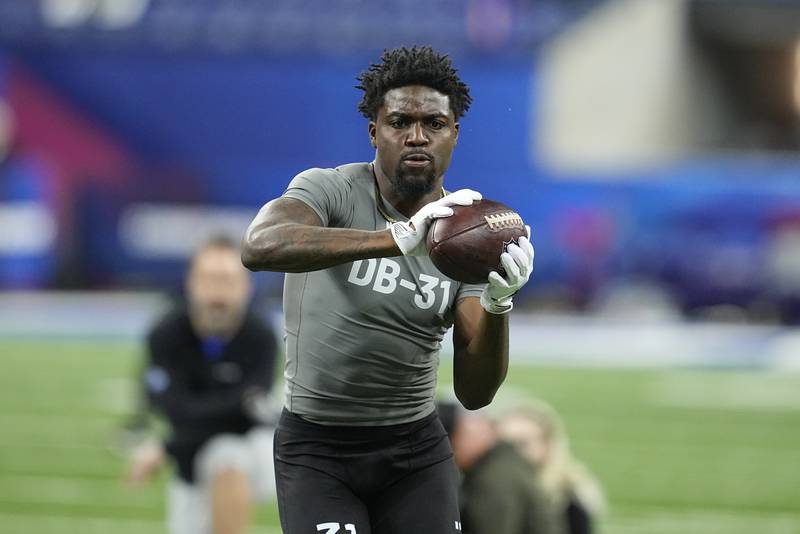 Miami defensive back Tyrique Stevenson runs a drill, Friday, March 3, 2023, at the NFL combine in Indianapolis.