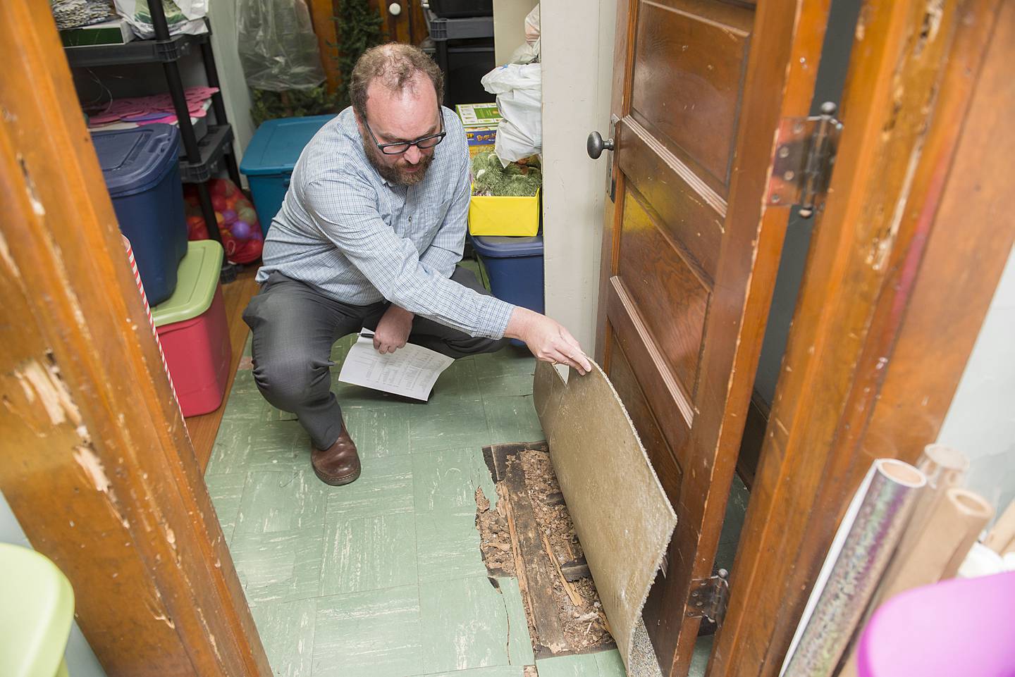 The floor and walls have been damaged by termites in areas of the building.