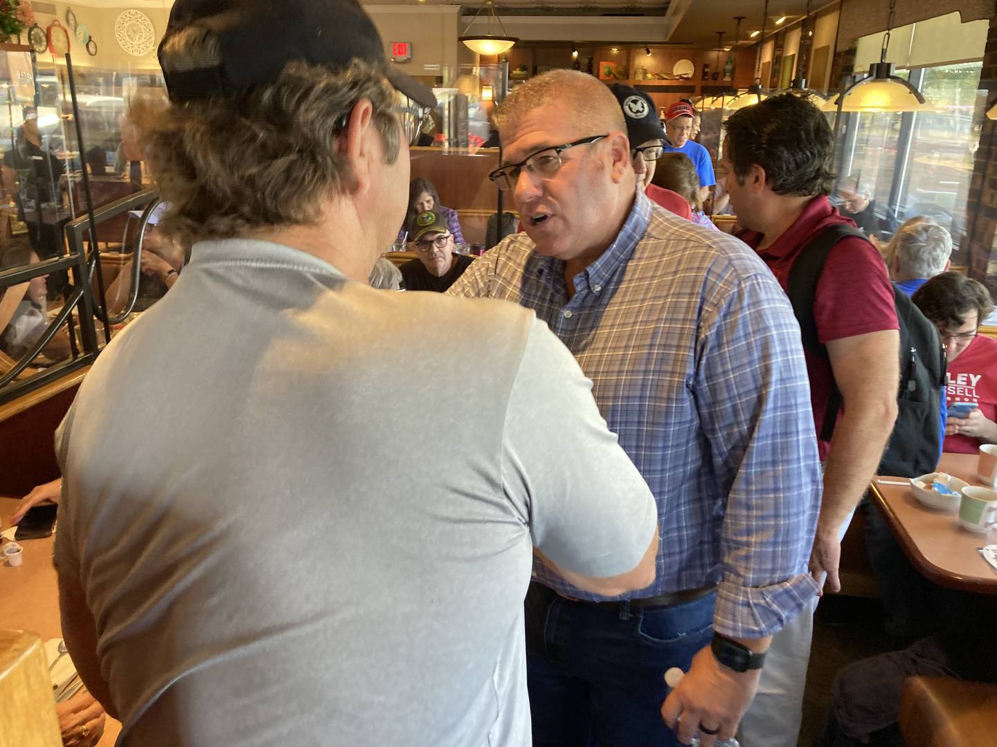 Republican candidate for governor, Darren Bailey, meets with potential voters Wednesday, Sept. 21, 2022, at Around the Clock Restaurant in Crystal Lake.