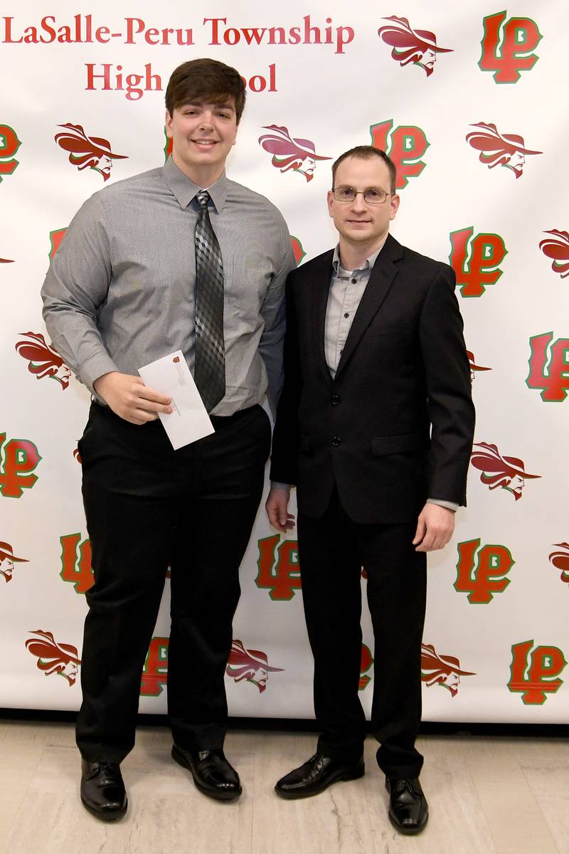 Adam Lane (left) received the Knights of Columbus Calvert Council 792 La Salle-Peru Scholarship. The $2,000 scholarship was presented by Grand Knight Kyle Foley (right).