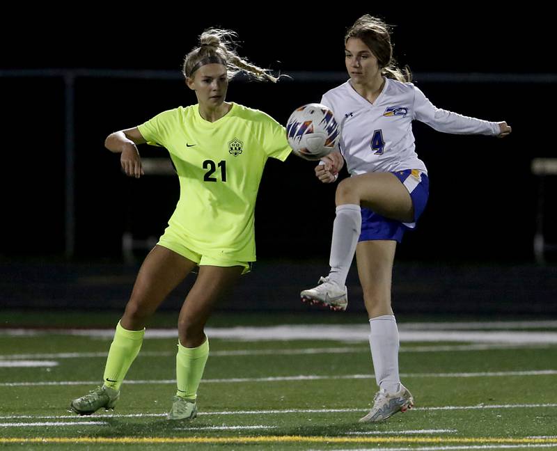 Johnsburg's Ava Jablonski kicks the ball away from Richmond-Burton's Blake Frericks during Kishwaukee River Conference Girls Soccer  Tournament Championship Match Wednesday, May 3, 2023, at Richmond-Burton High School.