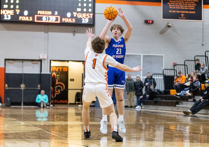 Marmion Academy guard Joseph Kramer shoots a three-point field goal during a game against St. Charles East High School on Saturday, Jan. 4, 2025.