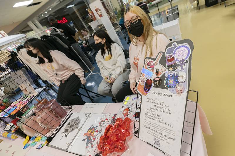 Domyneque Cantu (right), with sisters Hope (far-left) and Julia set up a booth to sell several unique and hand made items at the Northland Mall’s art and craft fair.