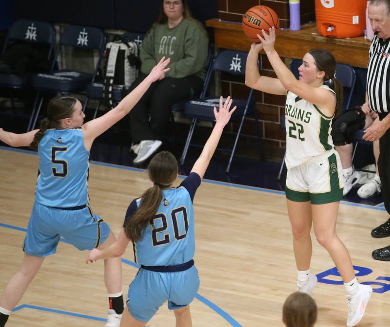 St. Bede's Ella Hermes shoots a jump shot over Marquette's Chloe Larson and teammate Kaitlyn Davis during the Class 1A Regional semifinal game on Monday, Feb,. 12, 2024 in Bader Gym.