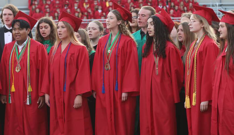 La Salle-Peru Township High School graduates sing "Good Riddance" (Time of Your Life) during the L-P Class of 2026 commencement ceremony on Thursday, May 14, 2026 at Howard Fellows Stadium.