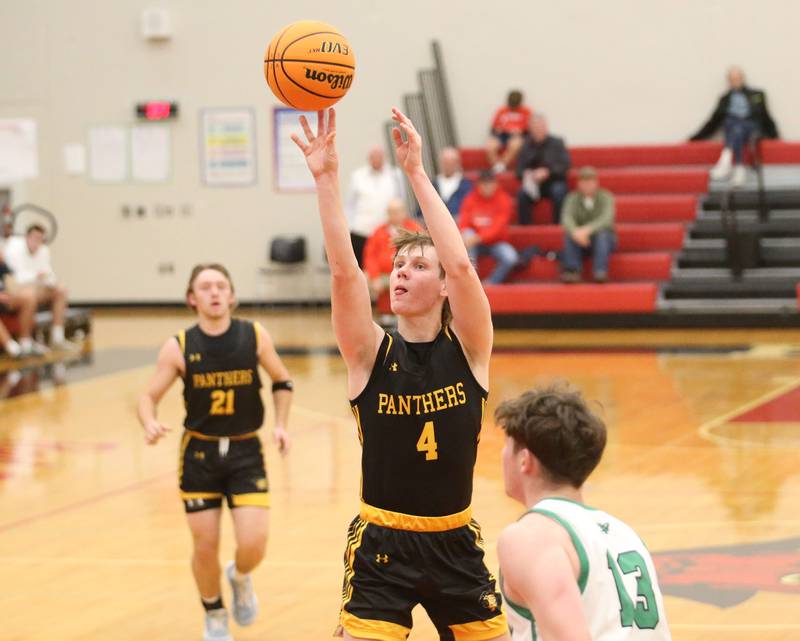 Rock Falls's Austin Castaneda eyes the hoop against Putnam County's AJ Furar during the 50th annual Colmone Classic on Monday, Dec. 9, 2024 at Hall High School.