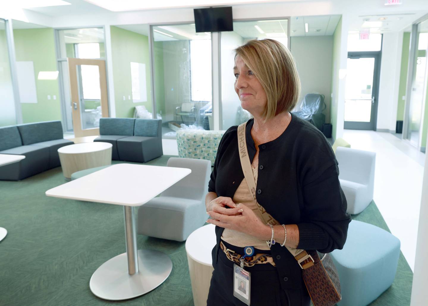 DuPage County Board Chair Deb Conroy tours the new DuPage County Crisis Recovery Center in Wheaton. The center will serve as an alternative to hospital emergency rooms. Family members, emergency medical services workers and law enforcement officials will be able to bring adults and young people experiencing a mental health or substance use crisis to the new facility.