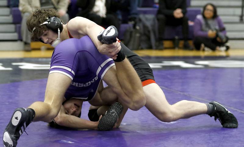 Huntley's Lucas Bittman controls Hampshire's Jasper Hintz during the 165-pound match of a Fox Valley Conference wrestling meet on Wednesday, Jan. 8, 2025, at Hampshire High School.