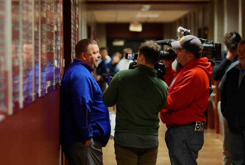Princeton coach Jason Smith meets with the TV crews following the Tigers' 46-42 win over Byron in Wednesday's sectional semifinals at Marengo.