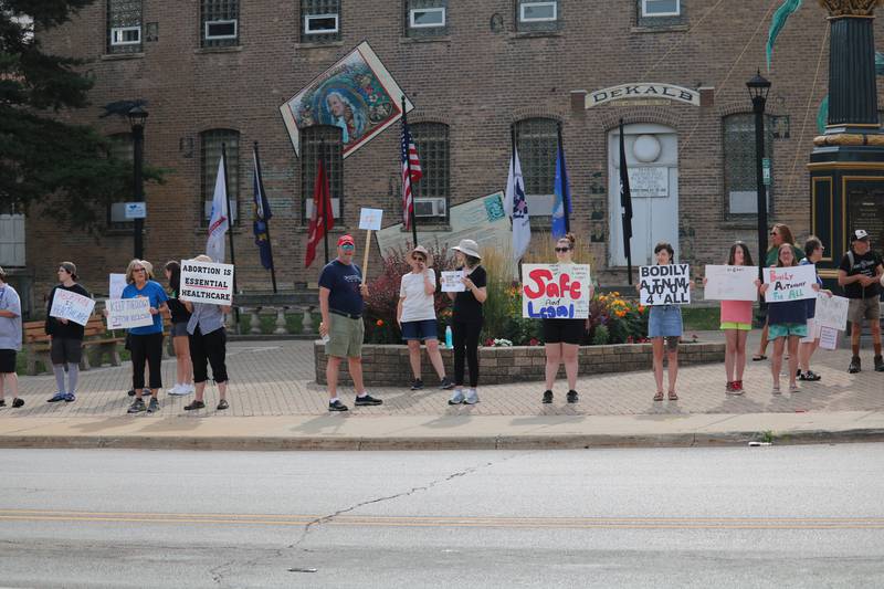 Attendees rally for reproductive rights during a protest on Monday, July 4, 2022 at the corner of First Street and Lincoln Highway in downtown DeKalb. The Independence Day gathering was organized to protest a recent ruling by the U.S. Supreme Court to overturn Roe v. Wade, which protected access to abortion under federal law.