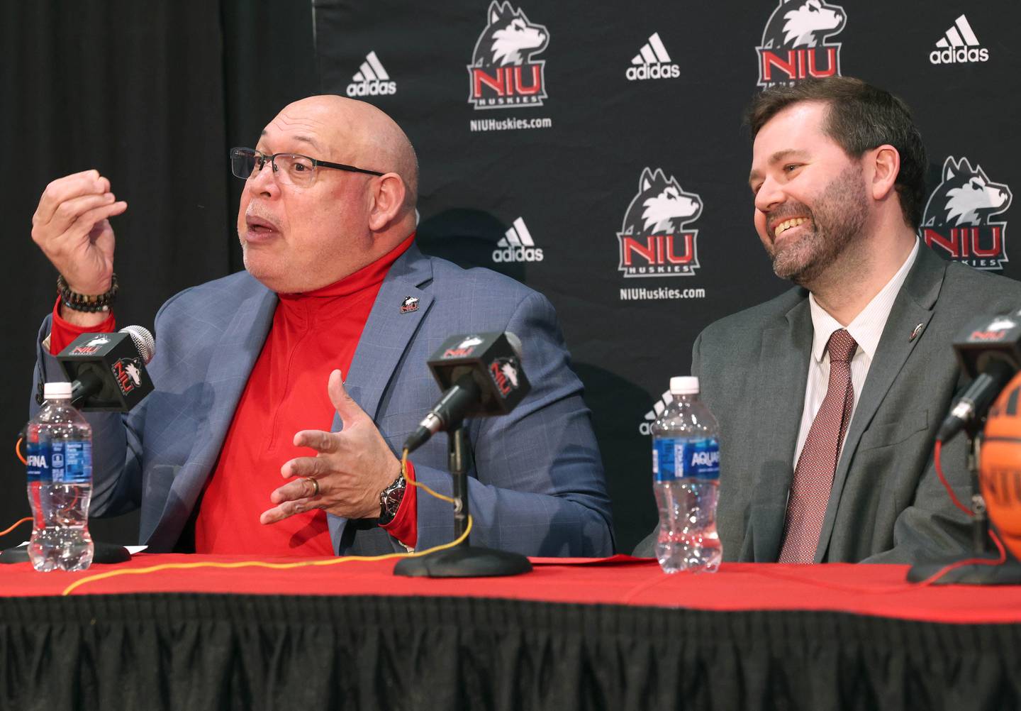 Northern Illinois University new men’s head basketball coach Matt Majkrzak (right) listens as NIU Vice President/Director of Athletics and Recreation, Sean Frazier, talks about the hiring process Tuesday, March 24, 2026, during a press conference introducing Majkrzak in the Convocation Center at NIU in DeKalb.