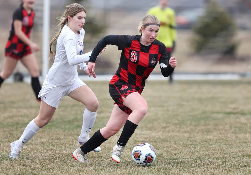 Indian Creek's Jolee Larson tries to pull away from Genoa-Kingston's Sophia Zaccard during their game Thursday, March 16, 2023, at Pack Park Sports Complex in Waterman.