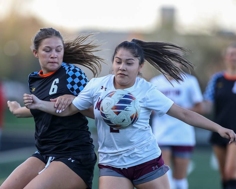 Morton's Crystal Ozuna (2) battles Willowbrook's Emily Barth (5) for possession during soccer match between Morton at Willowbrook.  April 15, 2024.