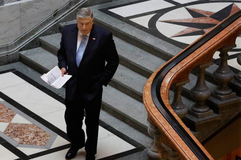 Illinois state Sen. Kirk Dillard, R-Westmont, leaves the Senate chambers at the state Capitol Friday, May  30, 2014, in Springfield Ill. (AP Photo/Seth Perlman)