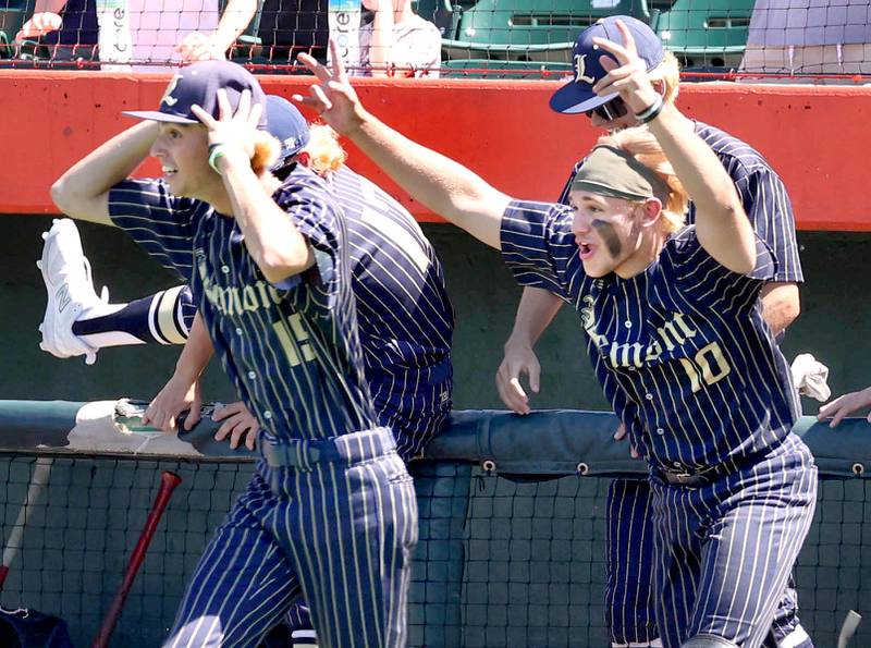 Lemont players rush the field after the last out of their Class 3A state semifinal win over Highland Friday, June 7, 2024, at Duly Health and Care Field in Joliet.