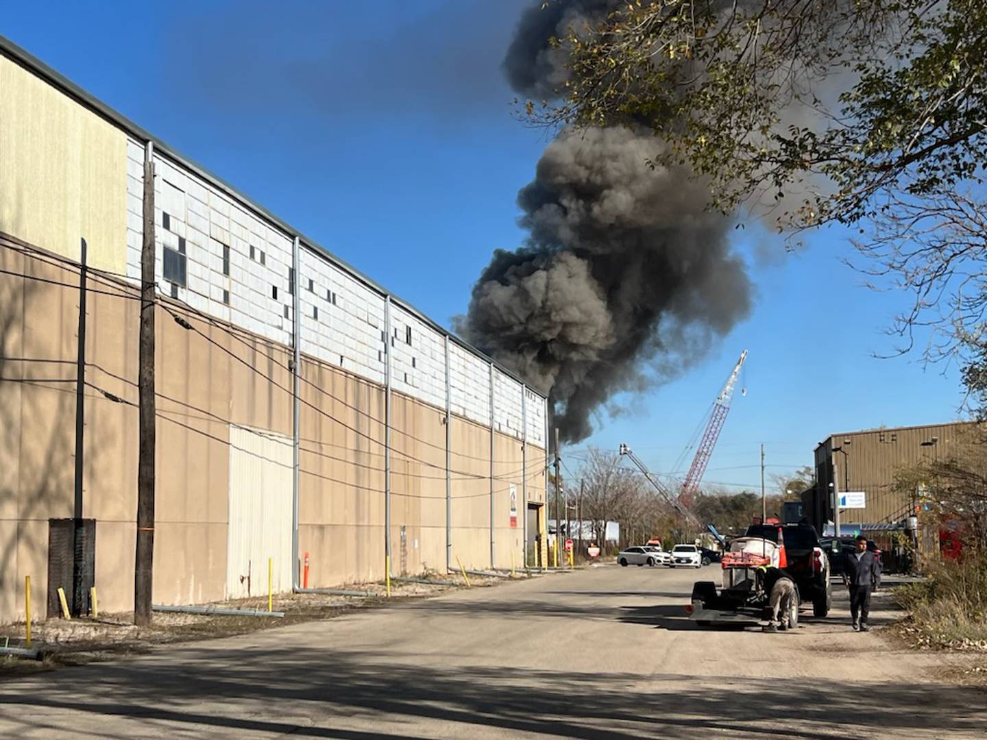 Smoke billows out from a burning pile of wood and metal along Industry Avenue at BL Duke Scrap Metal Recycling Yard, 2 Genstar Lane, in Joliet on Friday, Nov. 1, 2024.