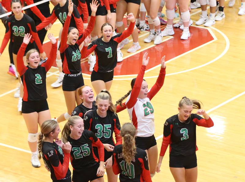 Members of the L-P volleyball team react after knocking off Ottawa in two-sets on Thursday, Sept. 21, 2023 at Kingman Gym.