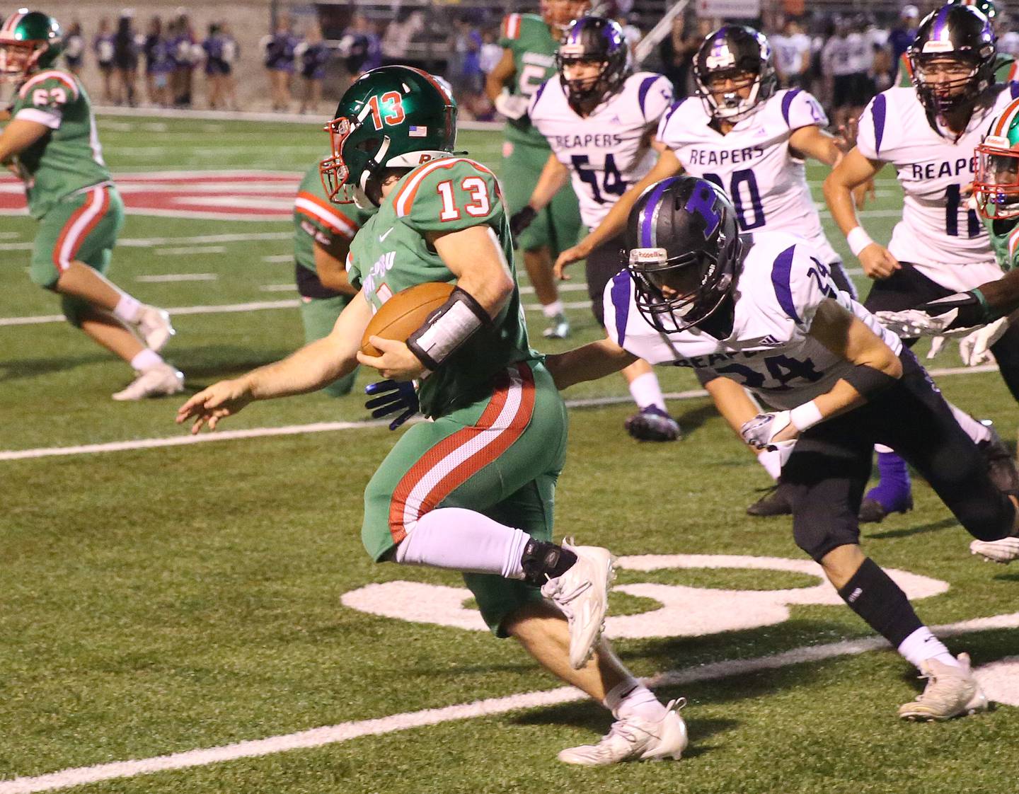 L-P's Brady Romagnoli runs the ball down the field as Plano's Tristan Meszaros looks to bring him down on Friday, Sept. 15, 2023 at Howard Fellows Stadium.