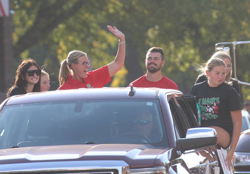 The sports training team rides on a float during the homecoming game on Thuesday, Oct. 2, 2025 downtown Peru.