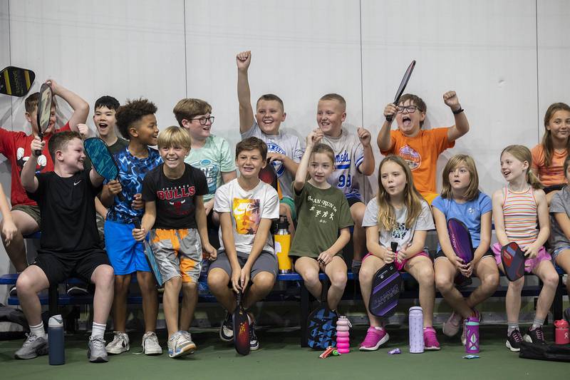 Students from St. Anne’s school celebrate a point by teacher Amy Seyller Wednesday, Sept. 17, 2025, in Sterling. P.E. instructor Steve Caudillo brought the fourth through seventh graders to Westwood to learn how to play pickleball from instructor Chris Duffy.