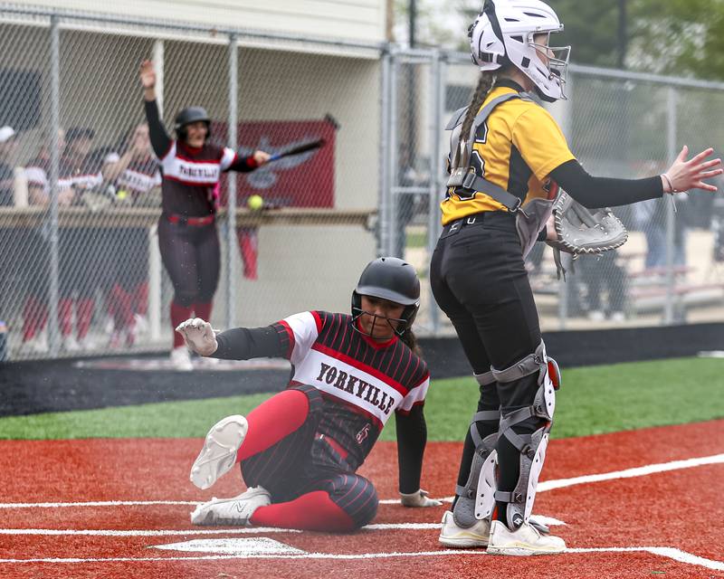 Yorkville's Liv Lathen (5) slides into home during softball game between Joliet West at Yorkville on Wednesday, April 30, 2025 in Yorkville.