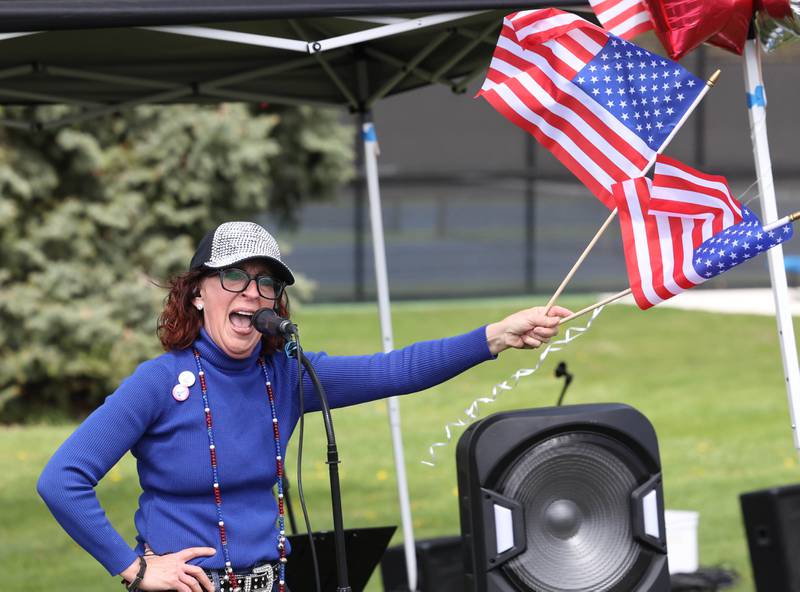 Anna Wilhelmi, head of the DeKalb County Democratic Party, speaks Saturday, May 3, 2025, at Hopkins Park in DeKalb during a May Day Rally for Democracy to protest against Trump administration policies.
