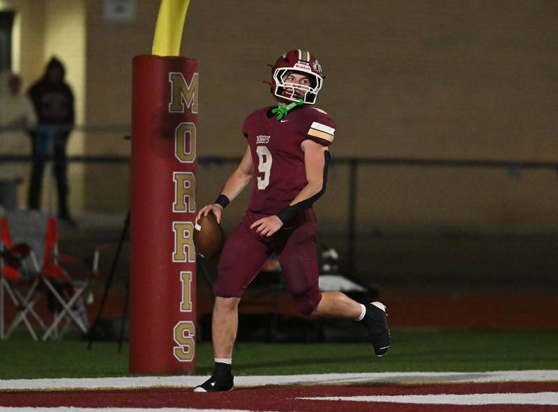 Morris' Caeden Curran (9) scores a touchdown during the class 4A first round playoff game against Woodstock on Friday, OCT. 31, 2025, at Morris.