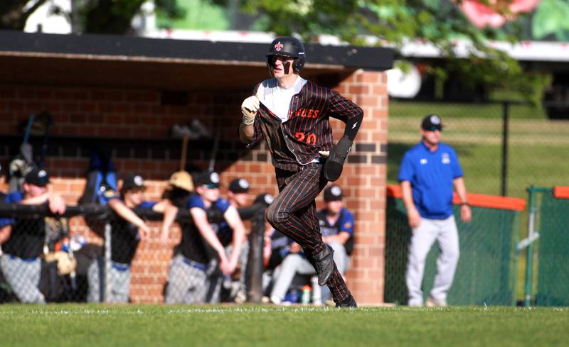 St. Charles East's Kyle LaRose runs home during a game against Geneva on Tuesday, May 13, 2024 in St. Charles.