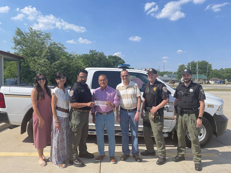 La Salle County State's Attorney Joe Navarro (fourth from left) presents a $23,000 check to Utica Police Chief James Mandujano (third from left) for the purchase of new equipment. From left are Utica Village Trustees Kylie Mattioda and Debbie Krizel, Utica Mayor David Stewart, Lt. Jason Quinn and Officer John Boyer.