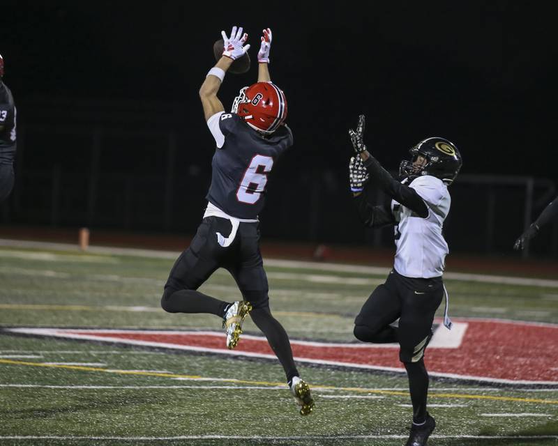 Yorkville's Hunter Niklos (6) breaks up a pass intended for Glenbard North's William Cook Lesley (5) during Class 7A first round football game between Glenbard North at Yorkville. Friday, Oct 31, 2025 in Yorkville.