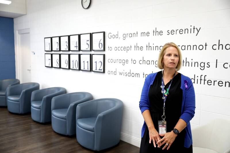 Karen Wolownik Albert, chief executive officer at Recovery Centers of America in St. Charles, shows one of the center’s group meeting areas.