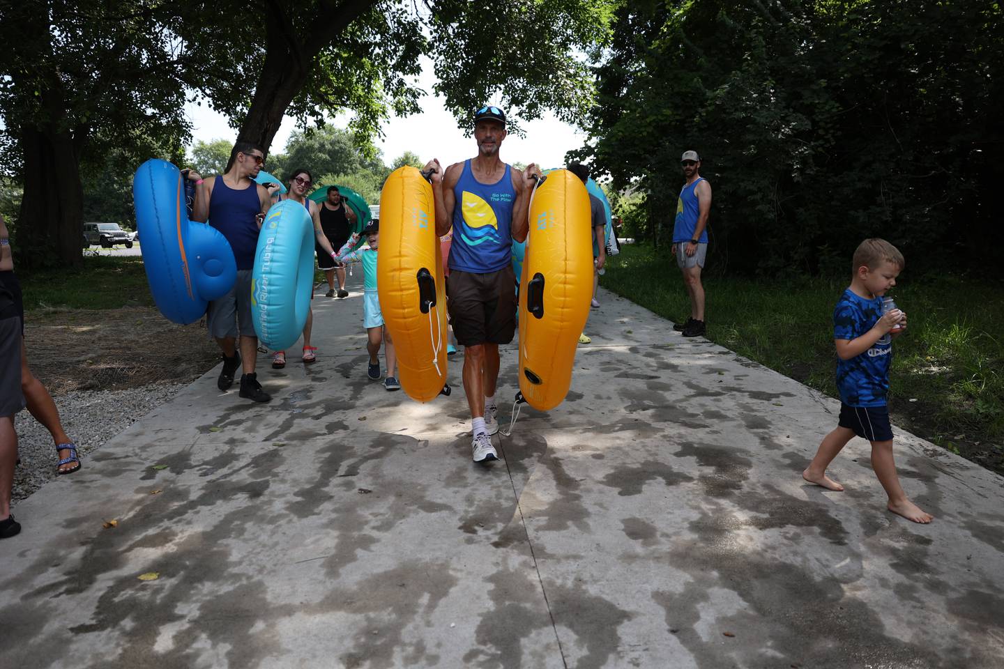 Scott Most, co-owner of Plainfield River Tubing, takes a group down to the DuPage River for tubing. Saturday, Aug. 27, 2022, in Plainfield.