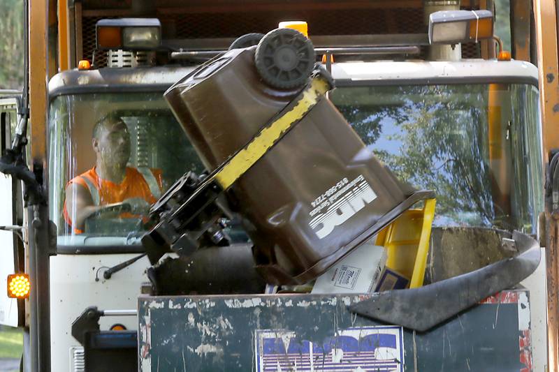 MDC Environmental Services picks up recycling on Friday, Aug. 16. 2024, along Sharon Drive in Woodstock.