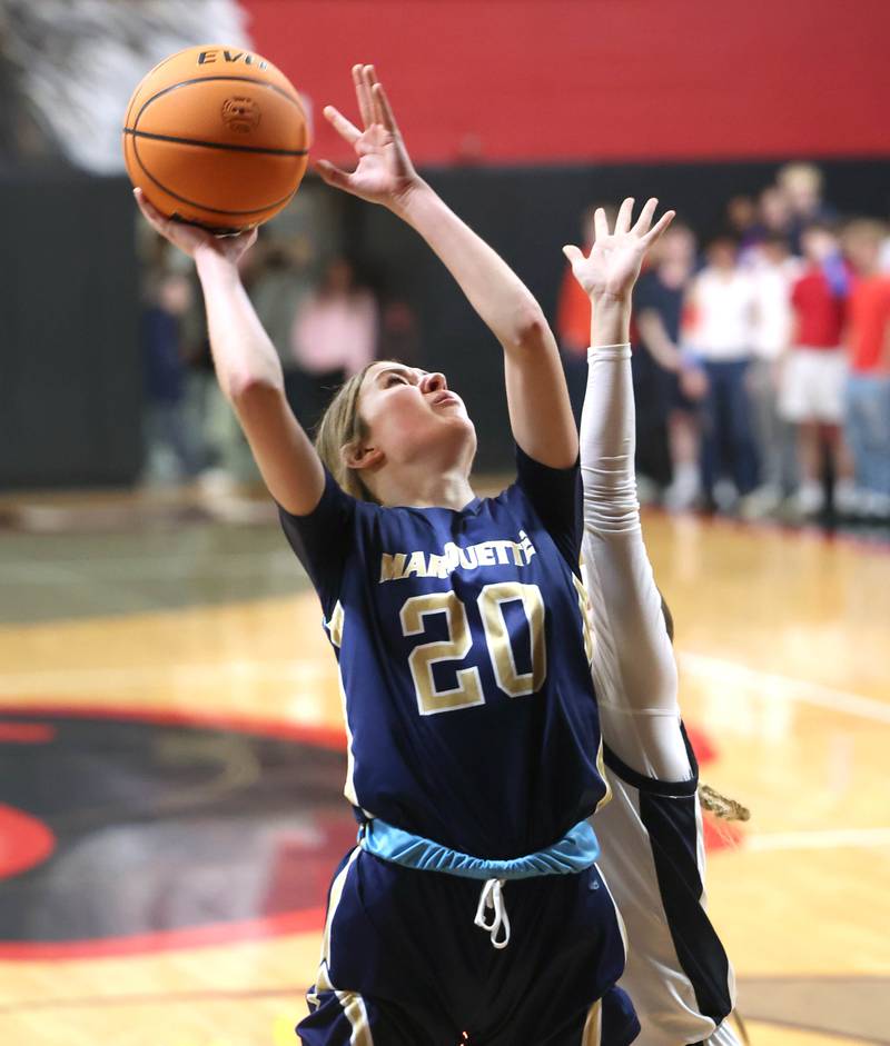 Marquette's Kaitlyn Davis gets a shot up over a Rockford Christian defender Tuesday, Feb 24, 2026, during their Class 1A sectional semifinal game at Indian Creek High School in Shabbona.