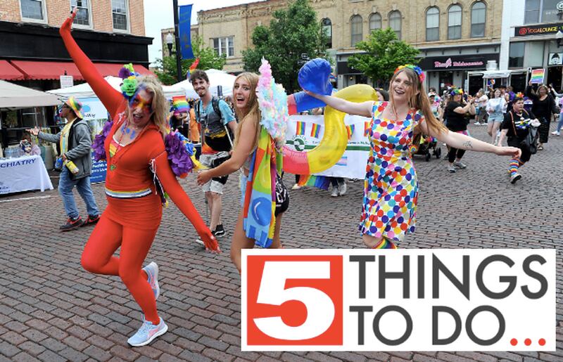 Vicki, Gigi and Jayley Clark dance during the Woodstock PrideFest Parade Sunday, June 12, 2022, around the historic Woodstock Square.